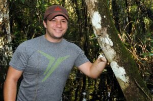 Jameson Coopman, shown here as a graduate student for Michael Kane, helped culture and replant the Ghost Orchid.